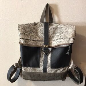 Myra Bag Black and Tan Patterned Foldover Backpack